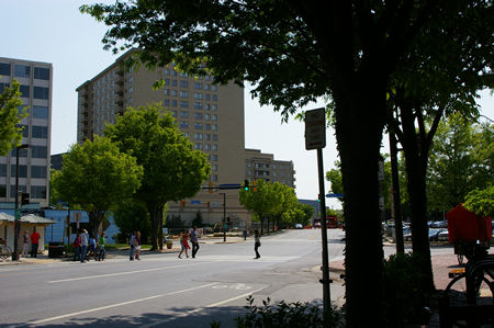 Pedestrians crossing Woodmont Ave against the light.