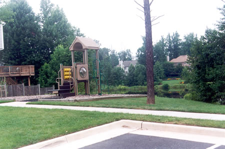 Follow the sidewalk past the play area and turn right onto the asphalt path.