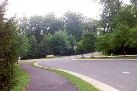 The path follows North Village Rd. on the west side.  Stay on the asphalt path.