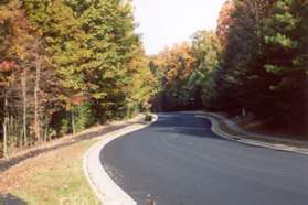 Cross North Village Rd at Bennington Woods Rd and take the wide asphalt path along the other side of North Village Rd going north.