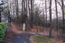 The paved trail turns right and no longer follows the street.