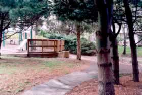 The trail curves to the right prior to a tot lot.  Turn left at the next intersecting trail.