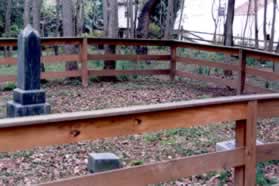 The path passes a wooden fence marking the Coffer Family Cemetery.