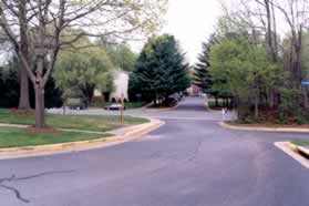 Take the sidewalk along Bunker Woods Ln to Wards Grove Cir and cross that street.