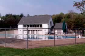 The building on the other side of the pool is the Commons Community Center.