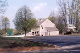 The building to the right just before the last turn is the Landings Community Center and adjoining pool.