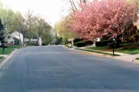 After crossing Oakview Park Dr. turn left to follow the sidewalk along that road.