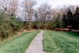 After crossing the dam turn left onto the intersecting trail.