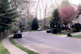 Turn left and follow the sidewalk at the intersection with New England Woods Dr.