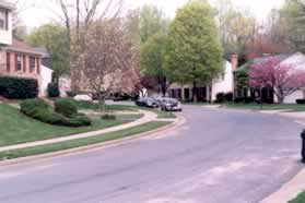 After crossing Natick Rd turn right and follow the sidewalk on the opposite side of that street.