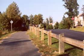 The path loops from the dam and follows a private drive to Bright Pond Ln.