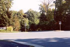 The path crosses Center Harbor Rd and continues along North Village Rd on the other side.