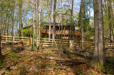 The trail passes between houses. This house is on the left side.