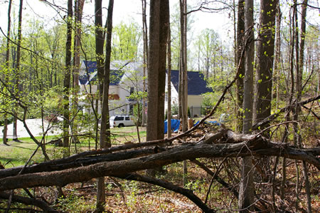 The trail passes between houses. This house is on the left side.