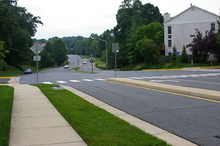 Turn right to cross Hunter Village Dr. in the crosswalk at Painted Daisy Dr. Then turn left to cross Rockledge Ct.