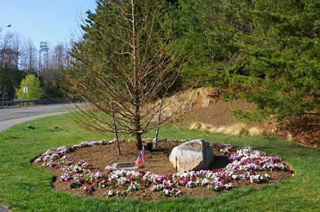 The trail passes a memorial on the right.