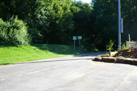 To continue on the next section of the CCT walk to the far end of the parking lot and take the asphalt trail to the right.