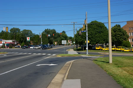 The trail crosses Rt. 29. The  yellow vehicles belong to a maid service.