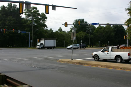 Turn right at Rt. 123 to cross Jermantown Rd. Then turn left to cross Rt. 123 using the Walk light.