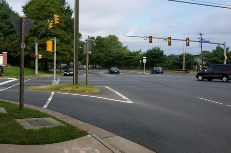 Cross Rt. 123 at the walk light. Then turn right to cross Jermantown Rd. Turn left to follow the asphalt trail on Jermantown Rd.