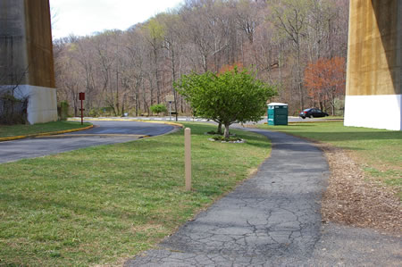 The trail starts at the Lake Accotink dam and follows the asphalt trail under the railroad bridge.