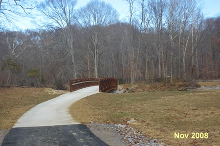 The trail crosses Accotink Creek on a bridge.
