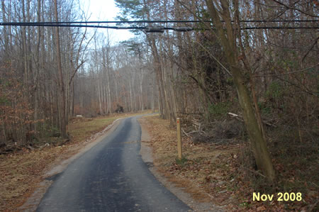 The trail passes a marker showing the old trail route.