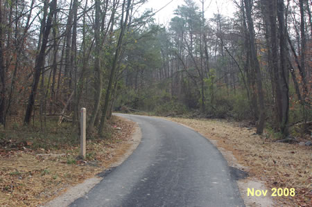 The trail passes a marker showing the old trail route.