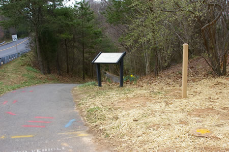 The walk starts from the southwest corner of Glade Dr. and Twin Branches Rd.  Take the asphalt path down the hill.