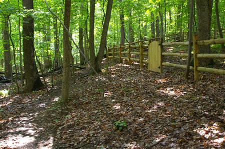 The trail passes close to a fence.