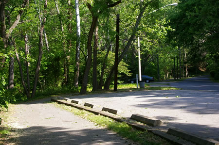 The trail passes 2 small parking areas.