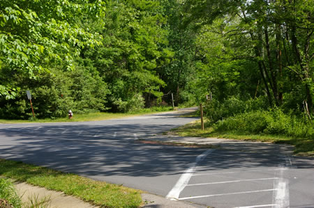 Turn right at the crosswalk and follow it across the road.