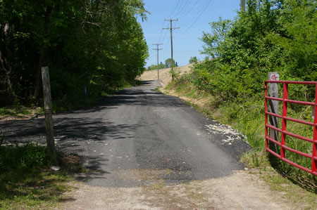 Follow the hard surface trail through the gate.