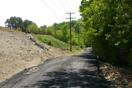 The trail passes a landfill on the left.