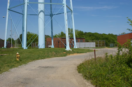 The trail goes around a water tower.