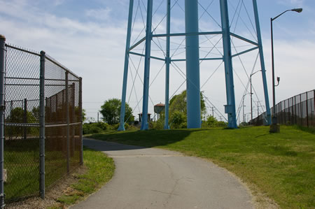The trail goes around a water tower.