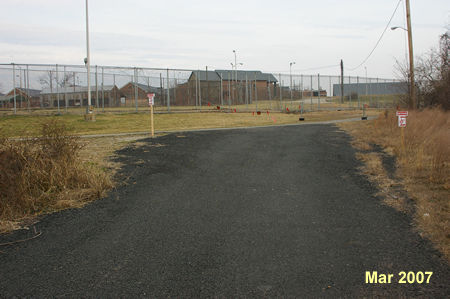 Upon reaching an access road around the former Lorton Prison take a sharp left to follow that road.