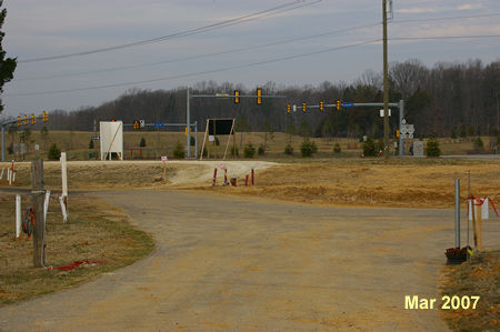 Upon nearing Rt 123 continue straight onto the gravel trail to reach an asphalt trail along Rt 123. Turn left onto that trail.