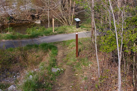 At the bottom of the hill turn right onto the asphalt trail.