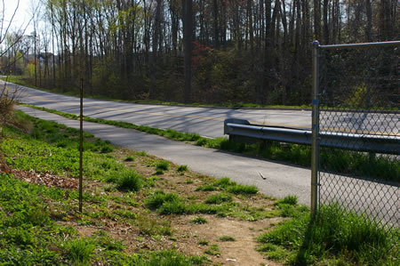 At the top of the hill turn right 180 degrees and take the asphalt trail over Pohick Creek on Pohick Road.