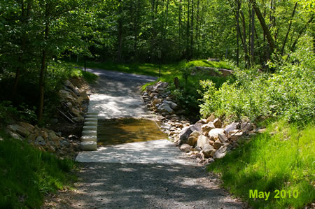 The trail crosses a side creek. Turn right at the intersecting trail.