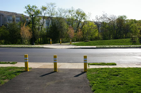 The trail crosses Paper Birch Dr. The asphalt on that road was poured the same day this picture was taken.