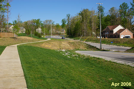 Creekside View Lane turns right to reach Pohick Road.  Continue straight on the sidewalk.