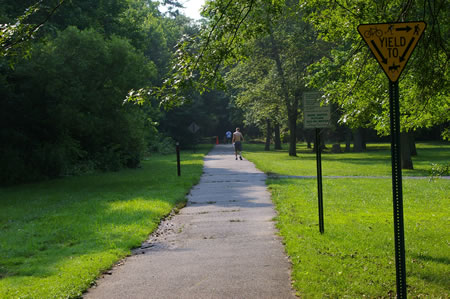 Walk east from the trail crossing at Prosperity Ave. The parking area should be on your right.