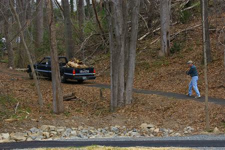 Workers clearing a side trail to Camelot Pool.