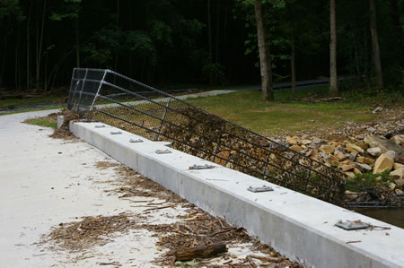 The railings were pulled out of the sockets embedded in the concrete bridge.