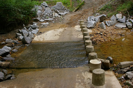 This crossing marks the end of this section of the trail. Continue across the creek and turn left to walk on the next section of the trail. The columns are too small in my opinion to be useful. The water is quite shallow here.