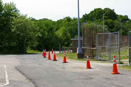 The perimeter road turns left to pass a baseball field. The field is open to the public.