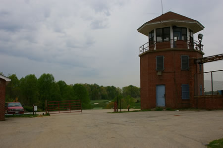 The perimeter road passes a final watchtower on the right.