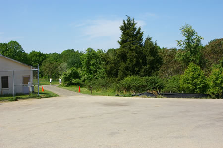 Turn left to follow a hard surface trail down a hill.